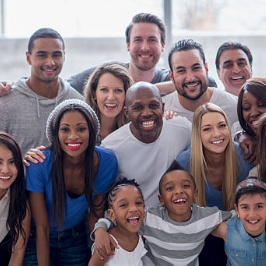 Image showing adults and children posing for a smile.